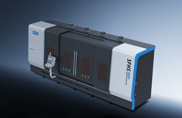 A large, modern industrial machine with a front-left control panel, labeled “דגם SFHS3050” on the right. Mostly black and gray with blue and white accents, it features glass doors at the center.