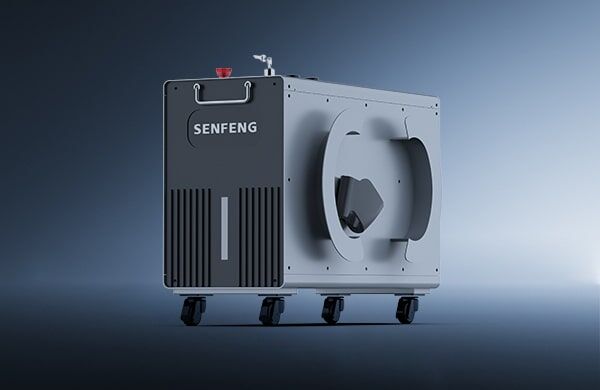 A gray and black industrial machine, דגם S, is shown on four wheels against a gradient blue background. The device features vents, a handle, and a circular side panel.