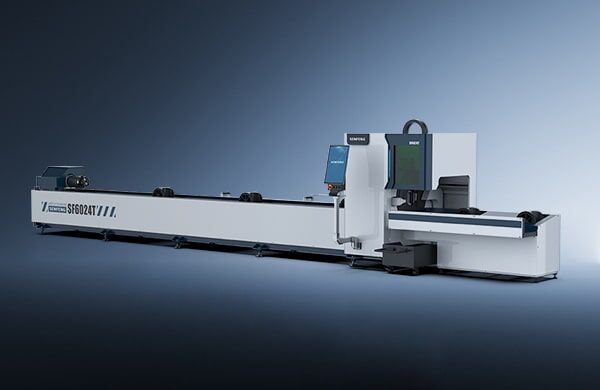 The דגם 6024T is a large, modern industrial tube laser cutting machine featuring a sleek white and black design, control panels, and an extended horizontal platform set against a gradient blue background.