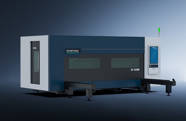 A large, modern industrial machine labeled דגם 1530N with a blue and gray exterior, glass windows, control panel, and a green signal light stands against a gradient background.