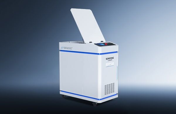 A white, box-shaped דגם HC 200-300 industrial machine with an open hinged lid, control buttons on top, and wheels, is shown against a gradient blue background.