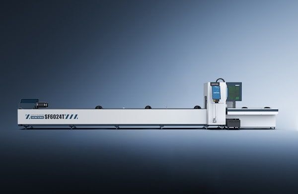 A long, white industrial laser cutting machine labeled דגם 6024T stands against a gradient blue background, featuring a control panel, display screen, and built-in components.
