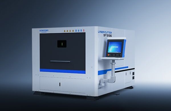 A large, white industrial laser cutting machine with a front control panel and screen, labeled דגם 1313G, is set against a gradient gray background.