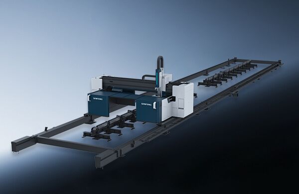 The דגם 1500CH is a large industrial CNC machine with blue and white components on a long metal frame, designed for automated cutting or machining of materials in factory settings.