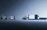 The דגם 1503CLH is a modern industrial machine featuring interconnected blue and white components, showcased on a gray surface with a blue gradient background to highlight automated manufacturing capabilities.