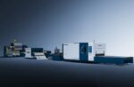 The דגם 1503CLH is a large industrial sheet metal processing machine featuring a coil feeder, straightener, and blue-and-white CNC cutting unit, shown against a gradient blue background.