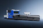 The דגם LYCK8463 is a large industrial machine with a blue and white exterior, digital display, and control panel, designed for manufacturing or machining processes and set against a gradient background.